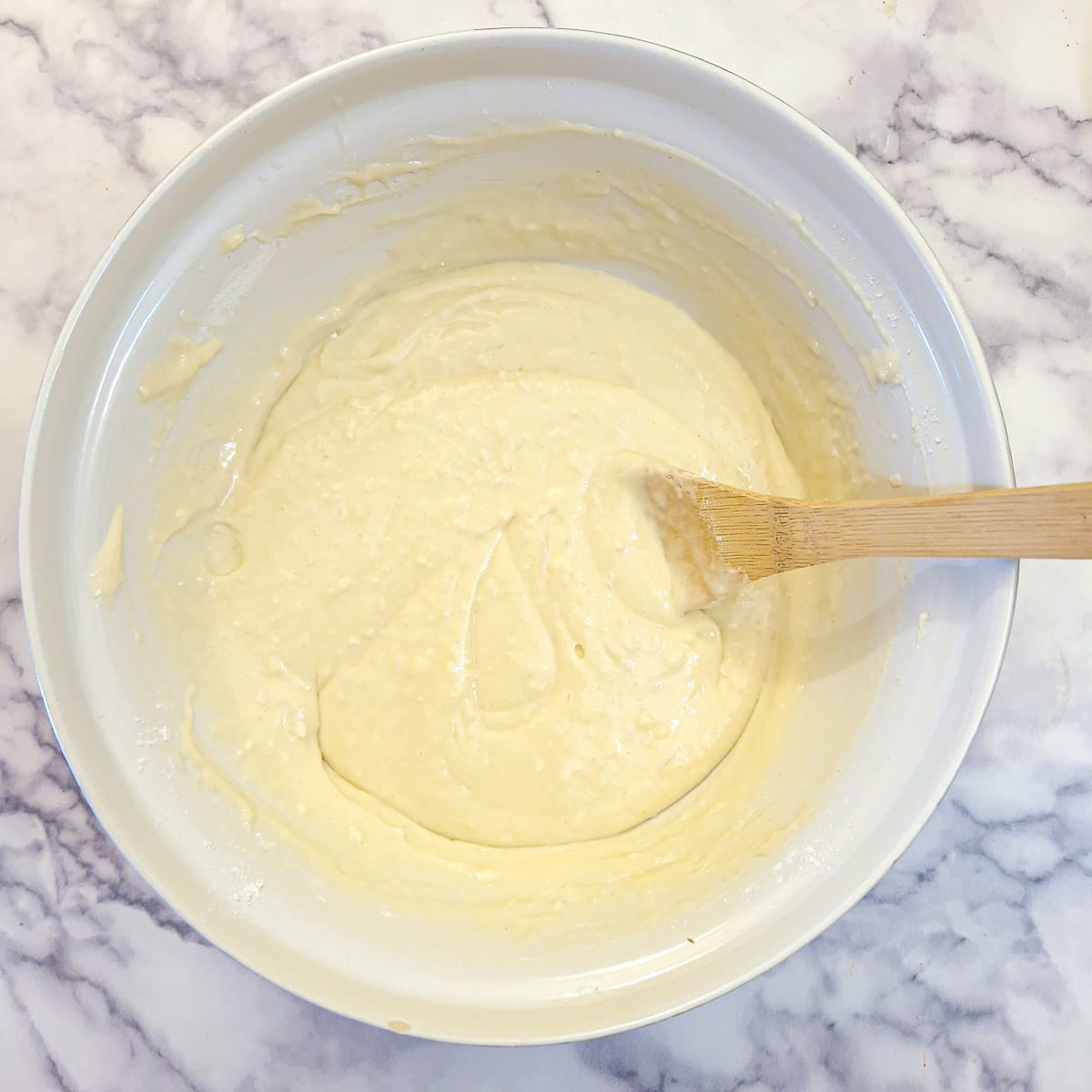 The batter for a strawberry mascarpone cake after the flour has been folded in.