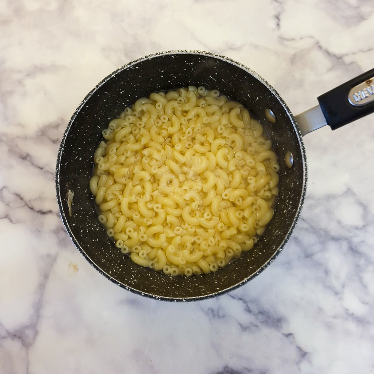 Cooked pasta in a saucepan.