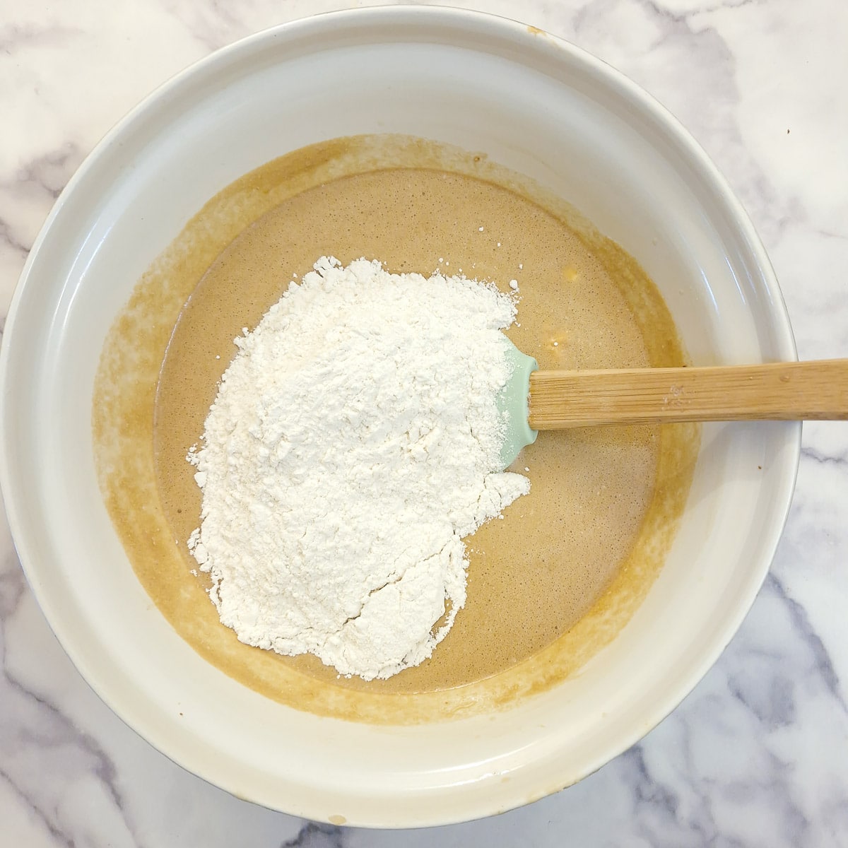 Flour added to the sticky toffee pudding batter.