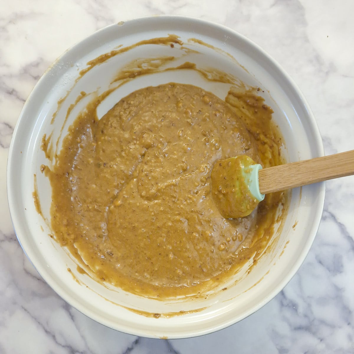 A mixing bowl containing the sticky toffee pudding batter.