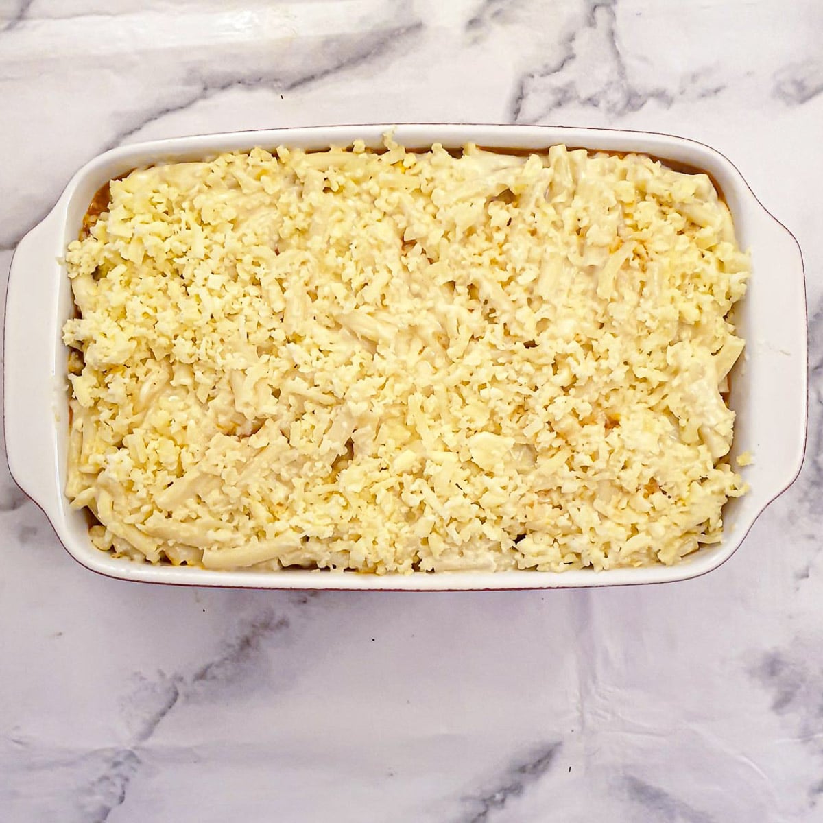 Step 11 - Add the remaining macaraoni and sprinkle with grated cheese.