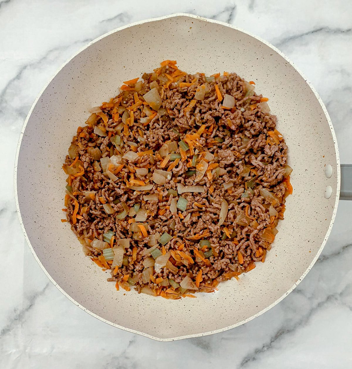 Step 2 - add the mince and stir fry until browned.