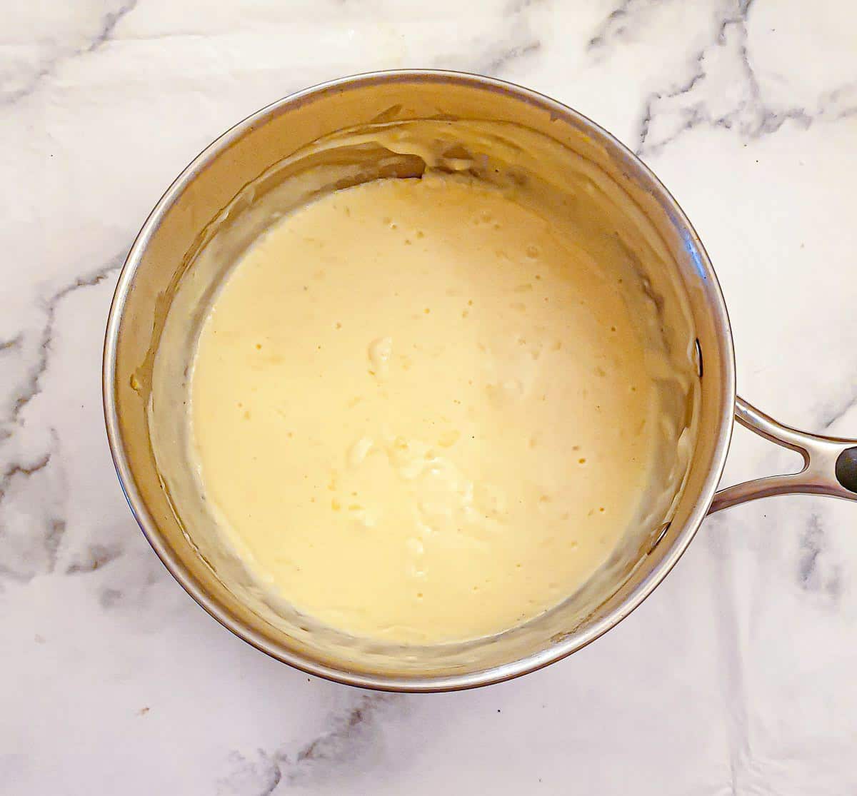 Step 7 - stir in the cheese and allow to melt.