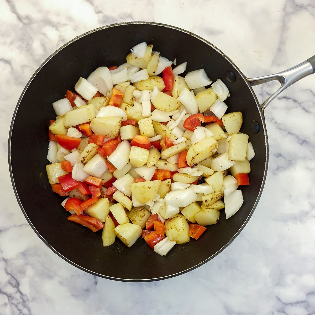 Step 3, add the onions and red pepper.