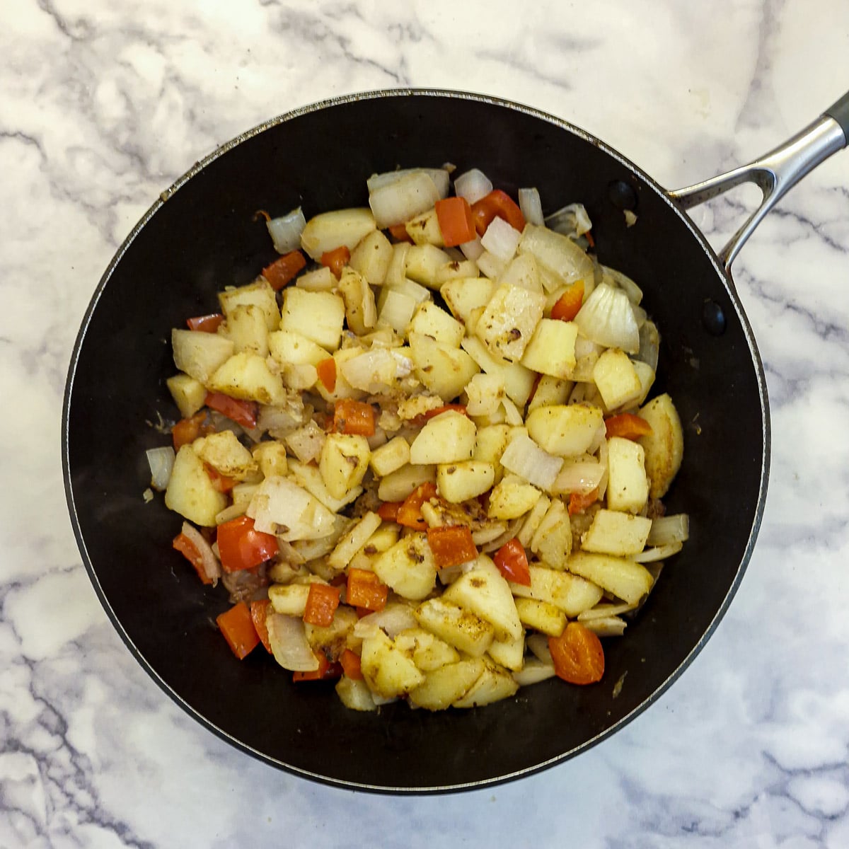 Step 4, saute the onions and peppers.