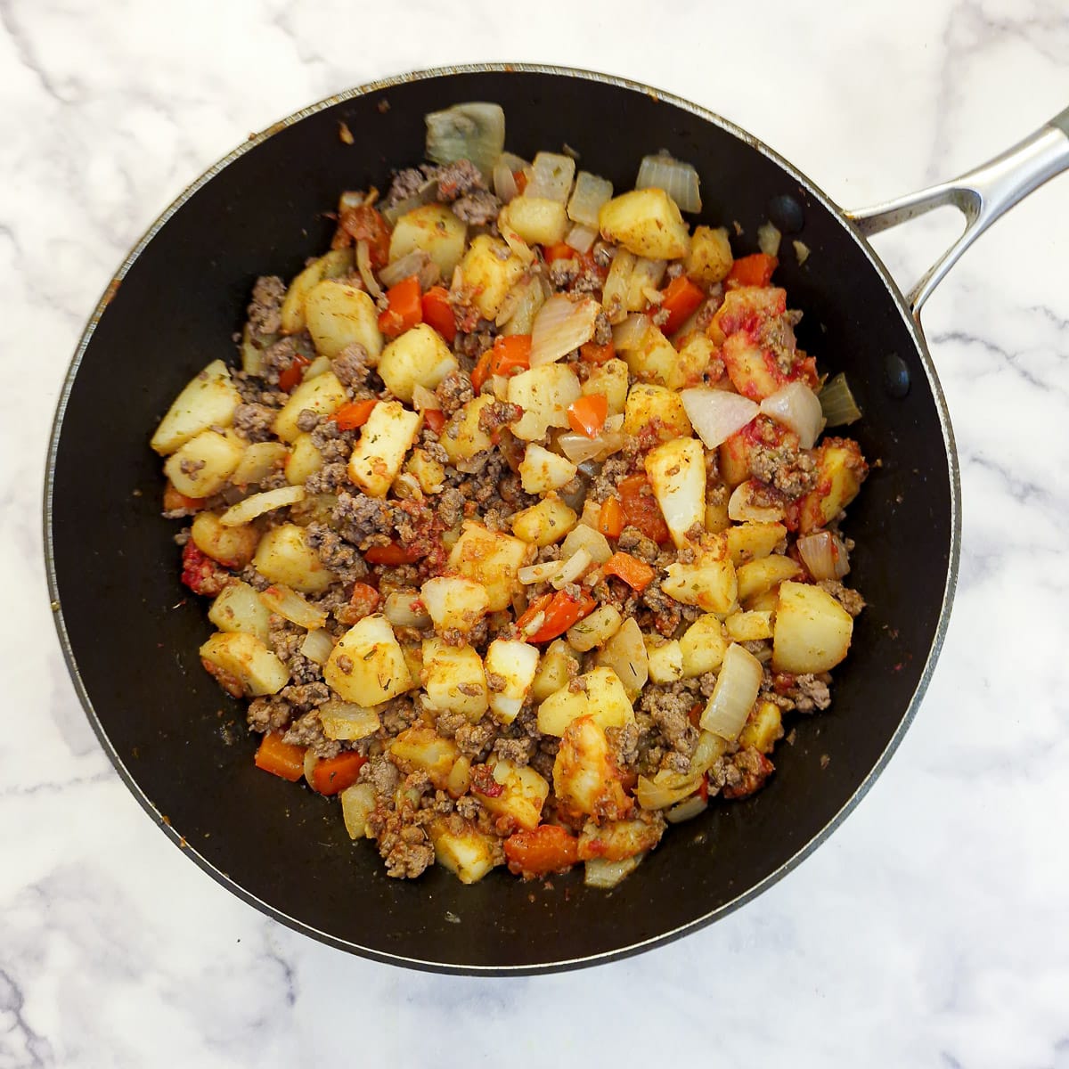 Step 5, return the mince to the pan and add the seasonings.