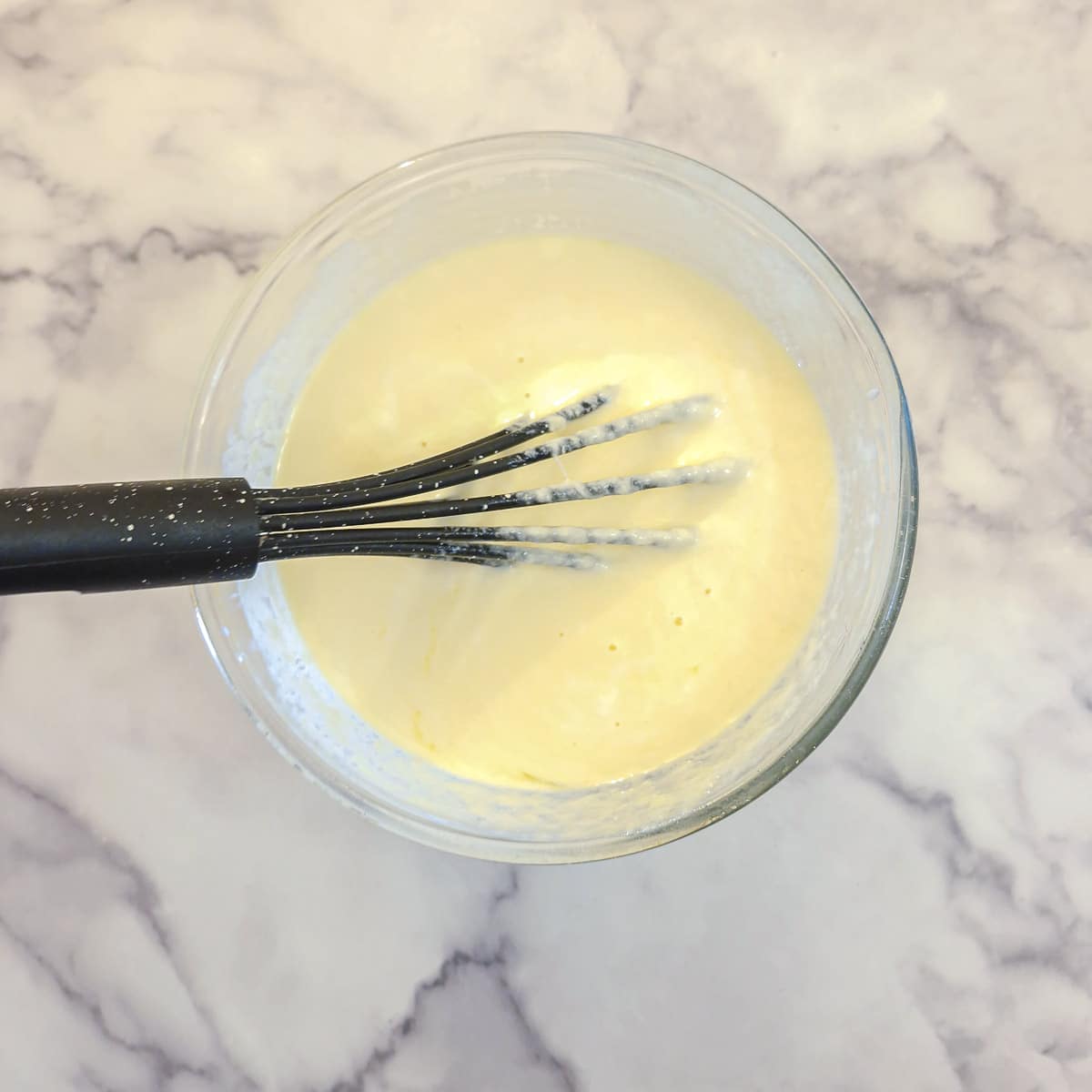 Use a balloon whisk to combine the yoghurt and eggs.