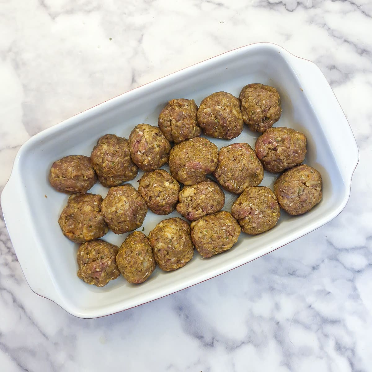 Step 3 - meatballs formed and placed in a casserole dish.