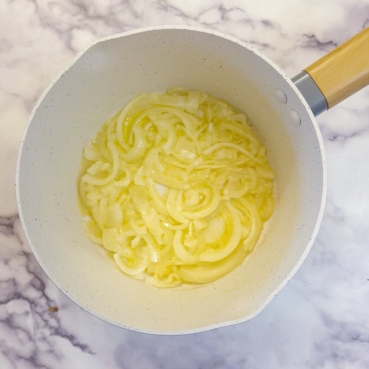 Step 5, onions frying in butter in a saucepan.