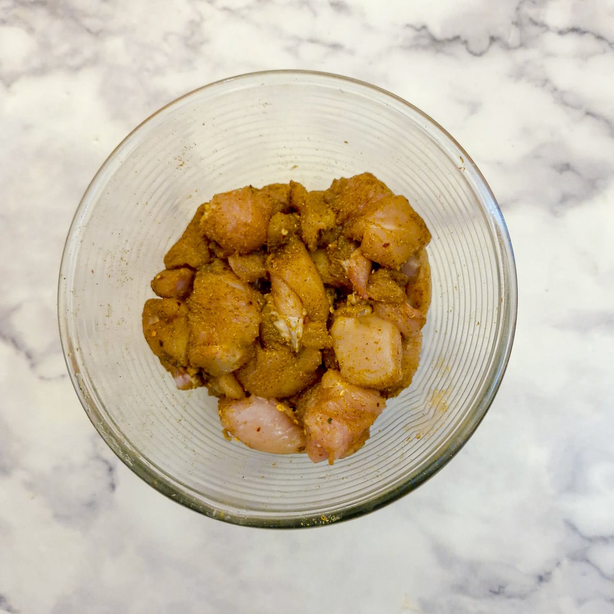 Step 1, chicken pieces marinating in spices.