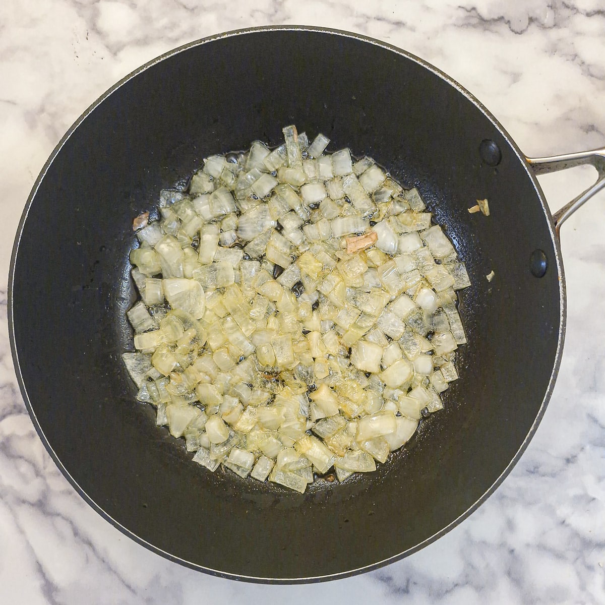 Step 3, onions softening in ghee.