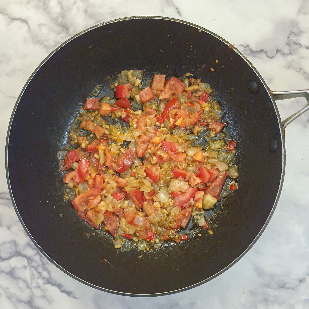 Step 5, chopped tomato softening with the onions.