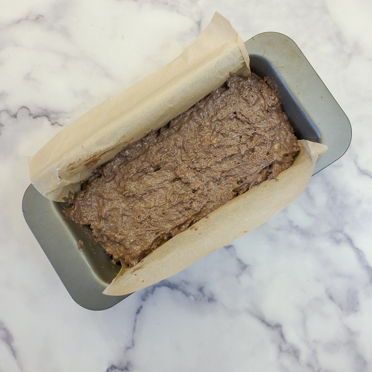 Step 3, transfer the cake batter to a lined tin.