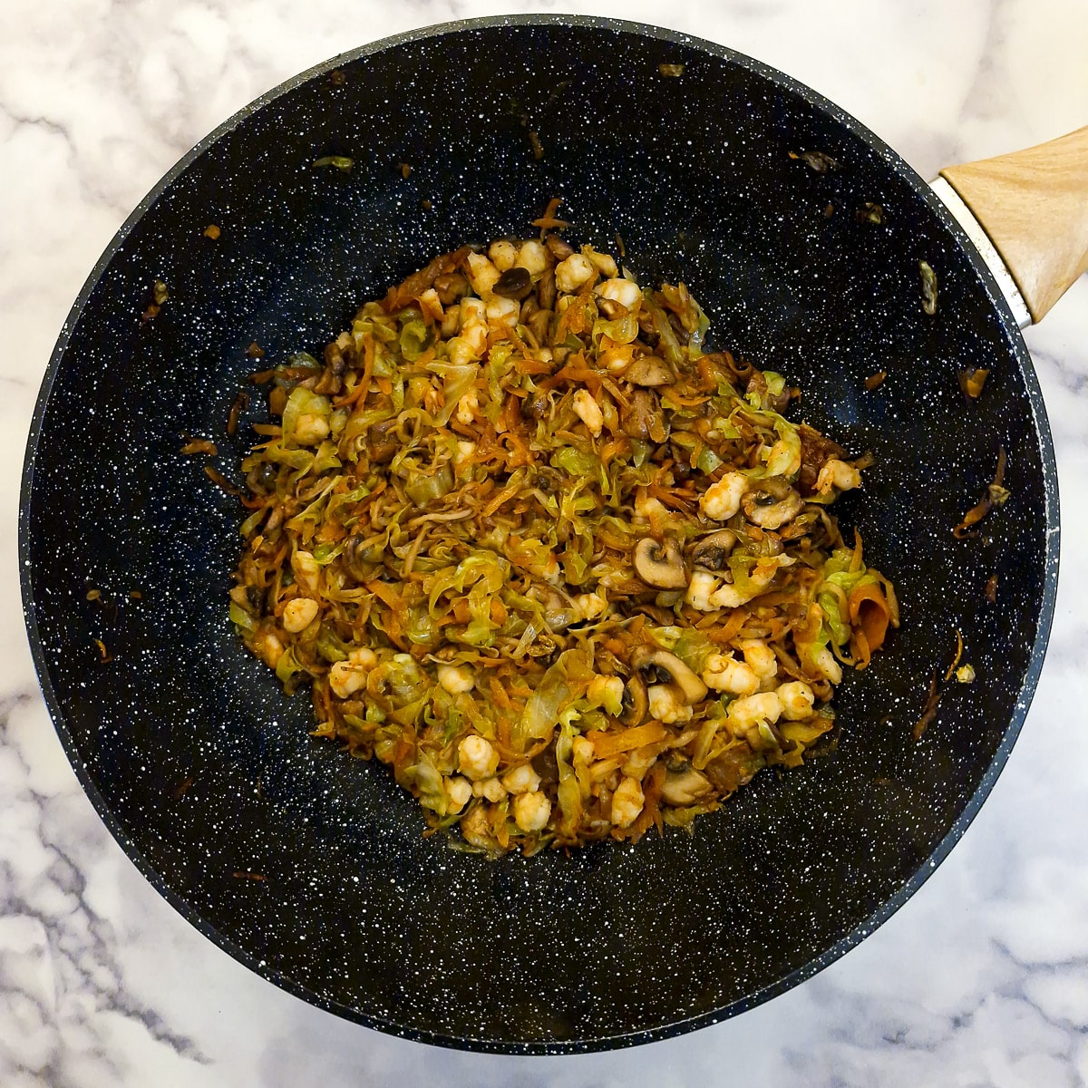 Step 4, prawn spring roll filling combined in a frying pan.