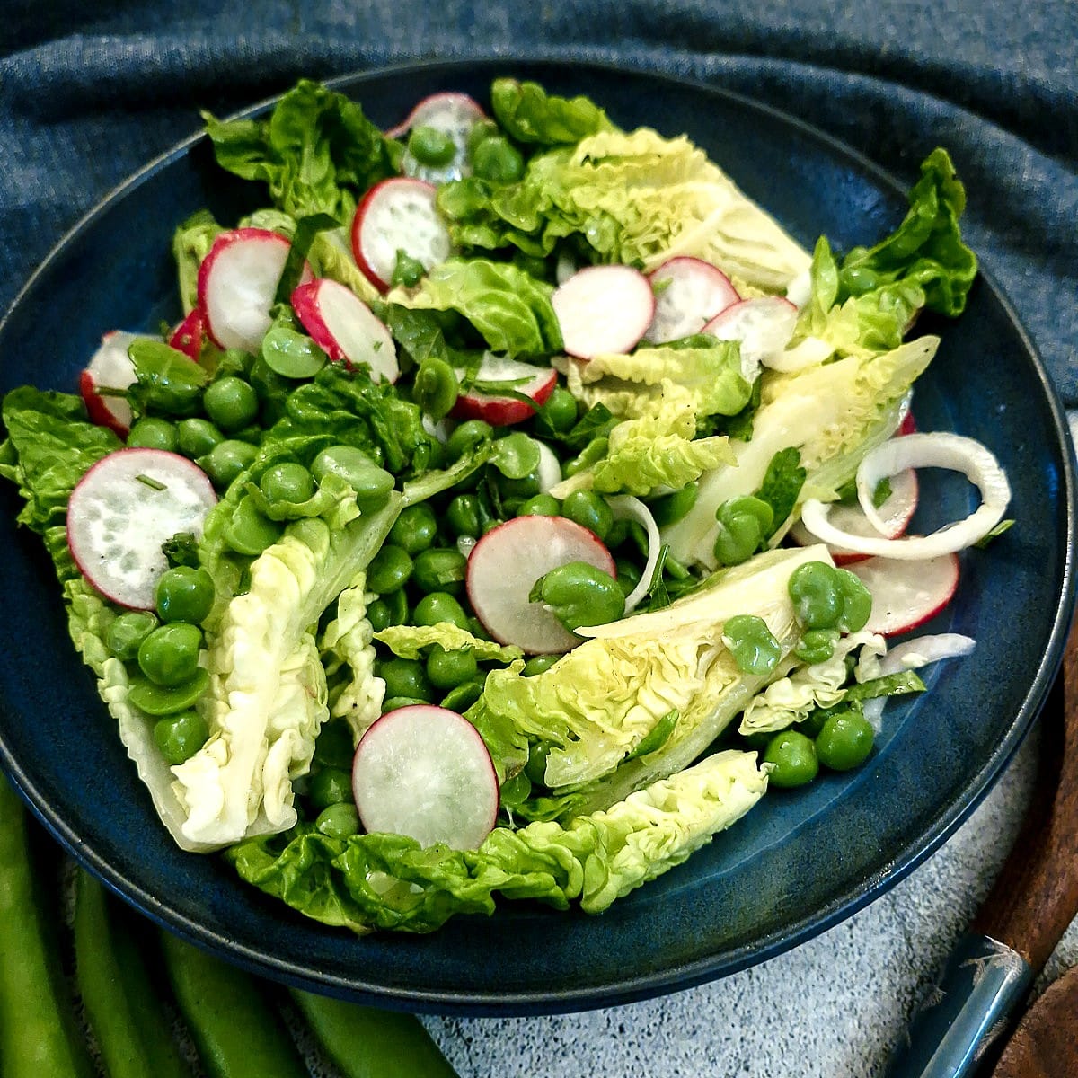 Closeup of a pea and broad bean salad.