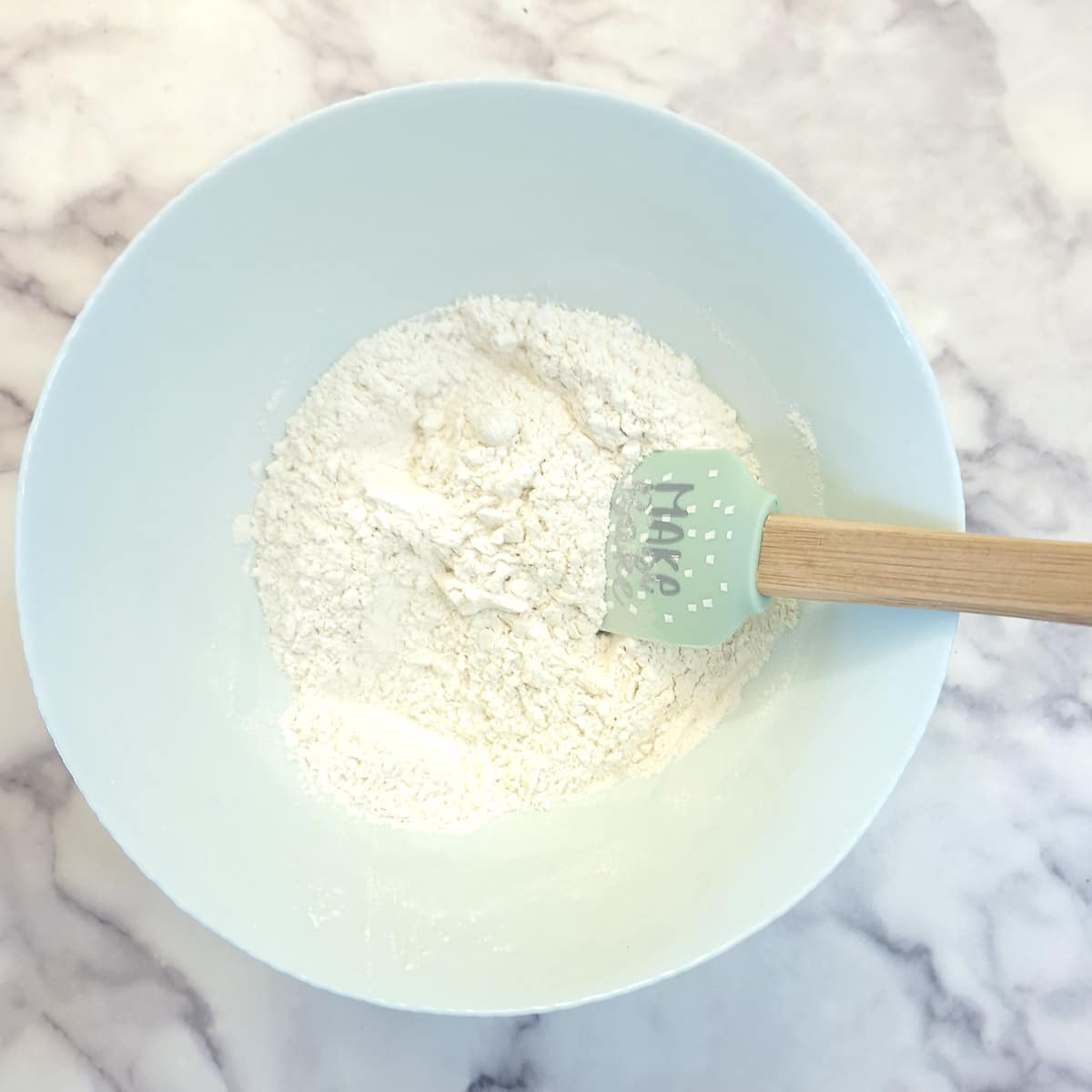 Step 1 - combine flour and sugar in a mixing bowl.