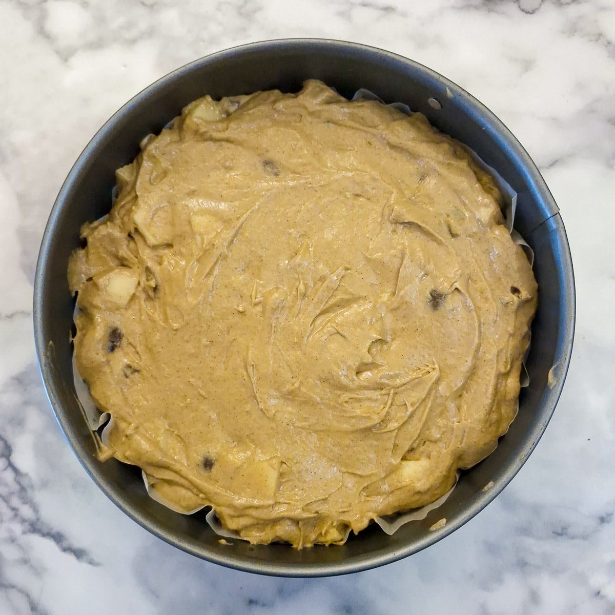 Step 5 the apple and chestnut batter poured nto a round springform pan.,
