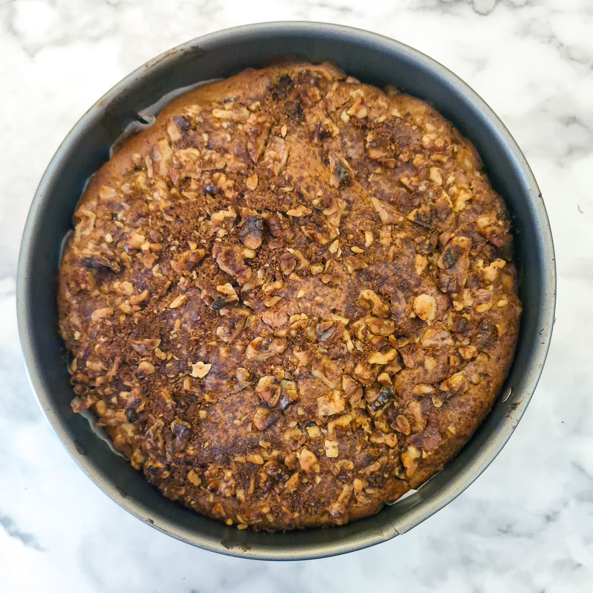 Step 7, a baked apple and chestnut cake with walnut topping.