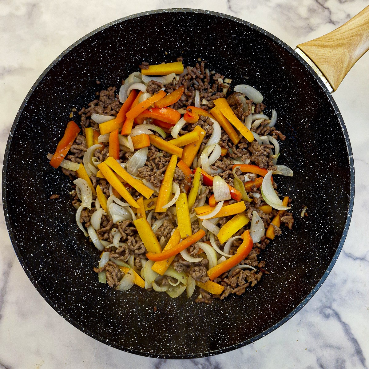 Step 2, slice onions, carrots and bell pepper combined with the mince.