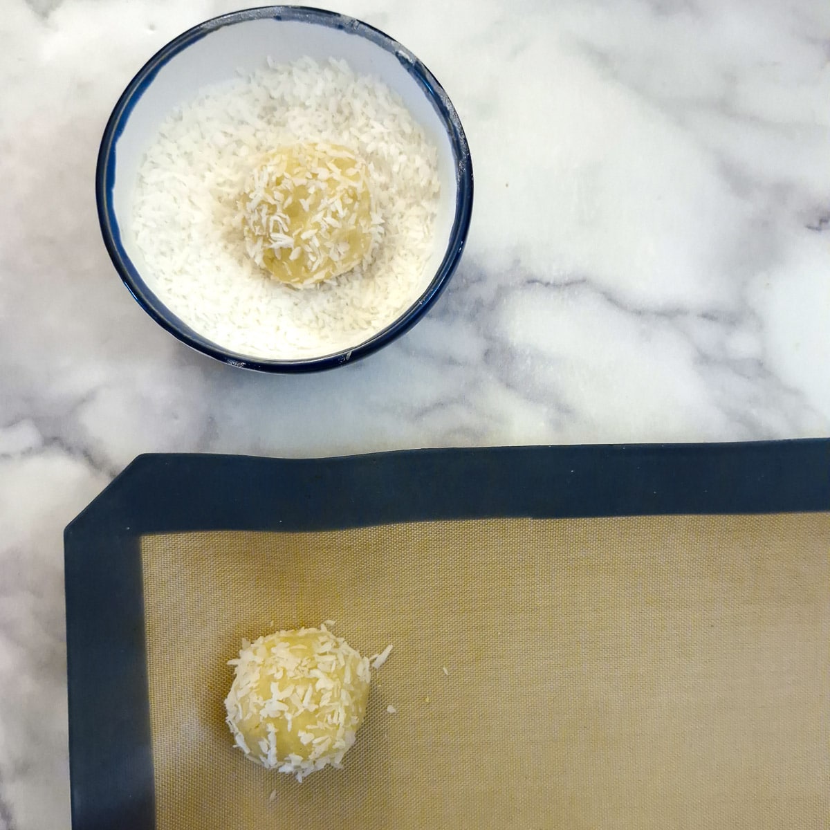 Step 4, a ball of dough being rolled in a dish of coconut.