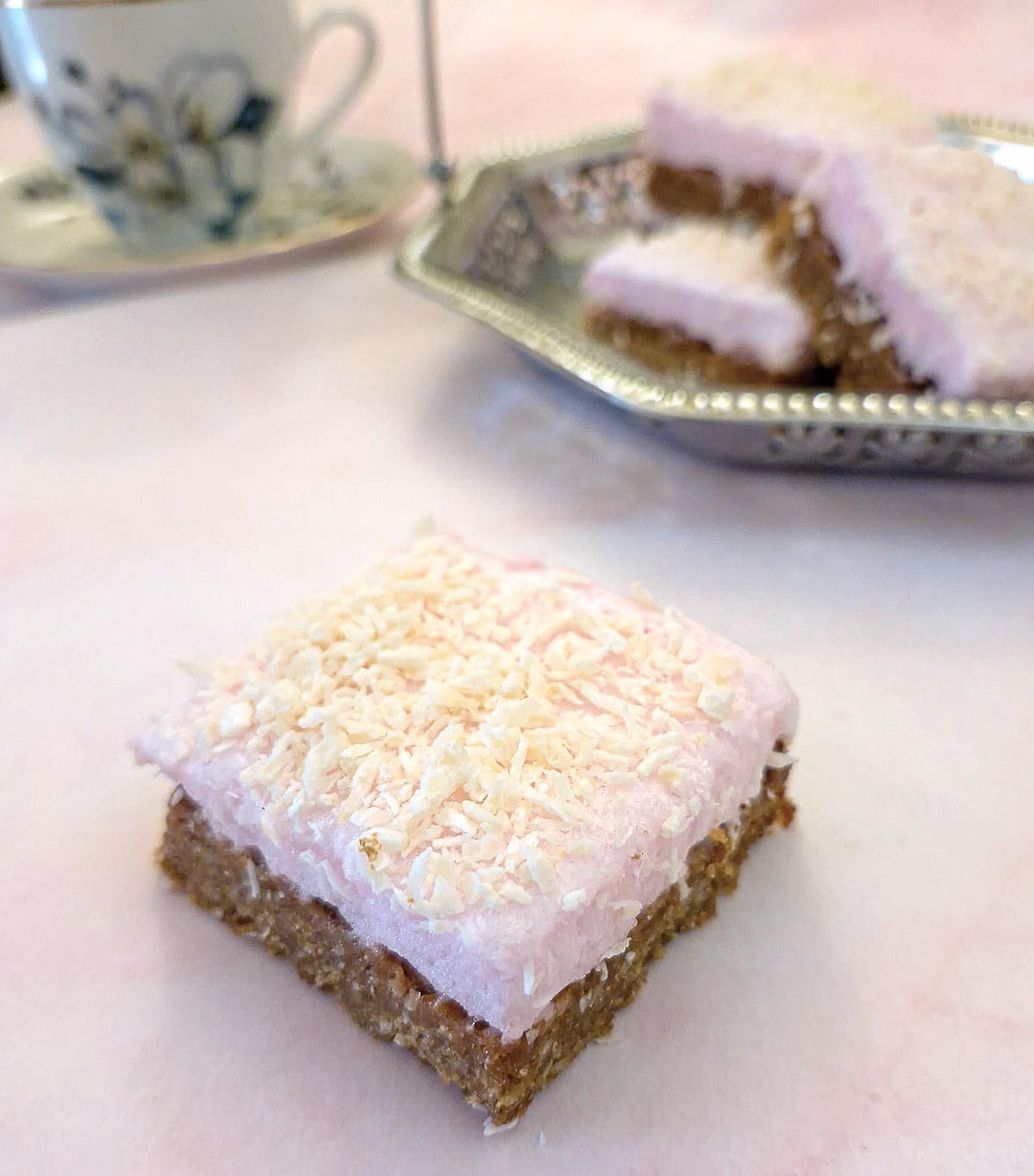 A square piece of coconut marshmallow slice.