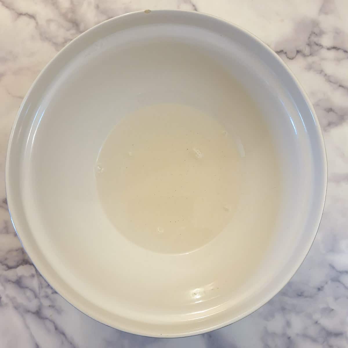 Cooled sugar mixture in a mixing bowl.