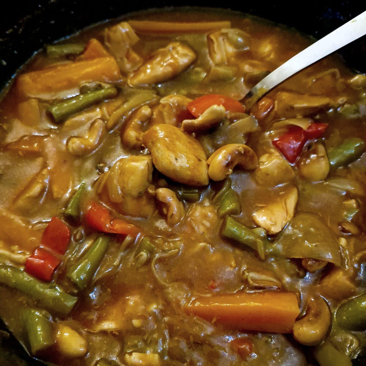 Close up of asian-style cashew chicken in garlic sauce.