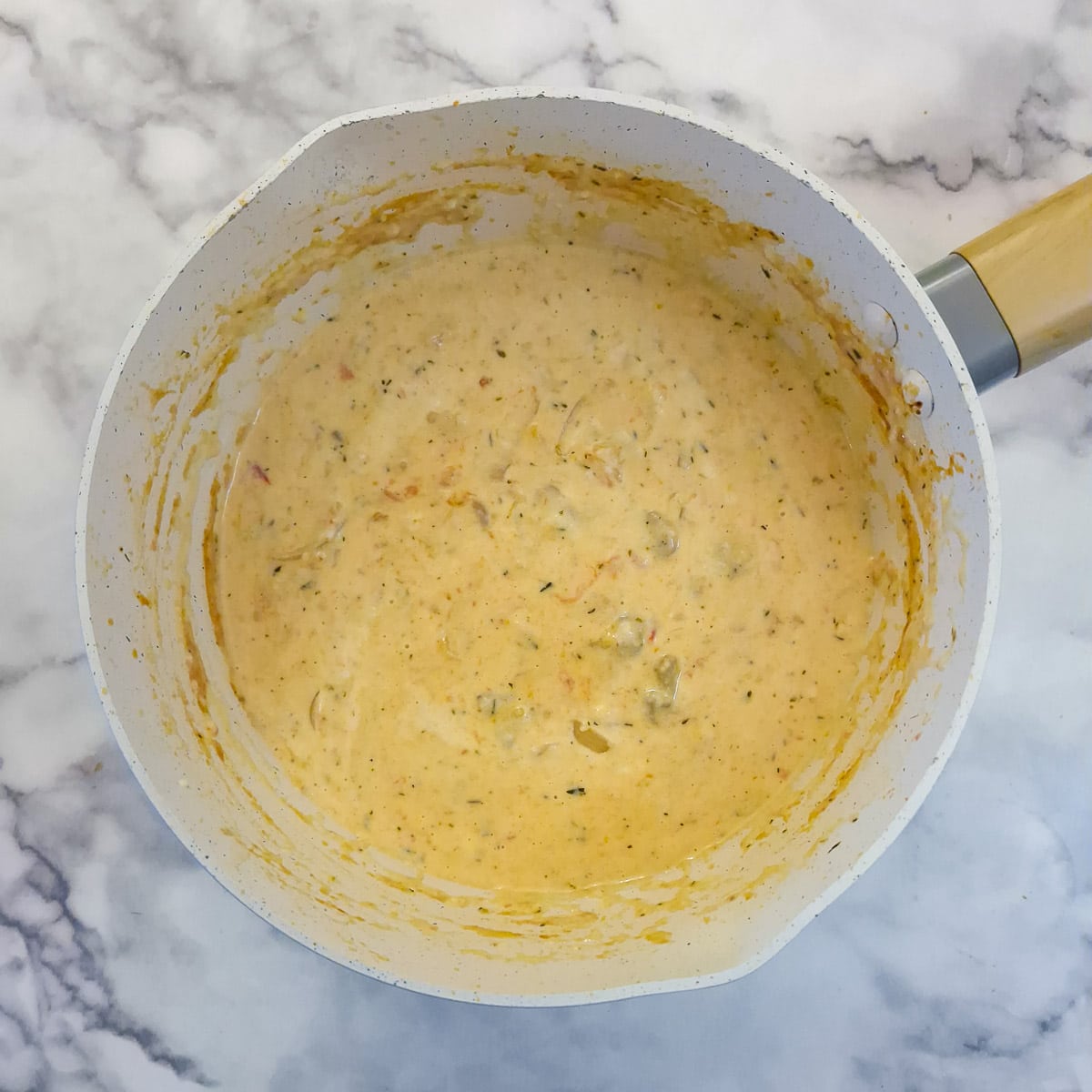 The egg mixture stirred into the tomato and onion mixture.