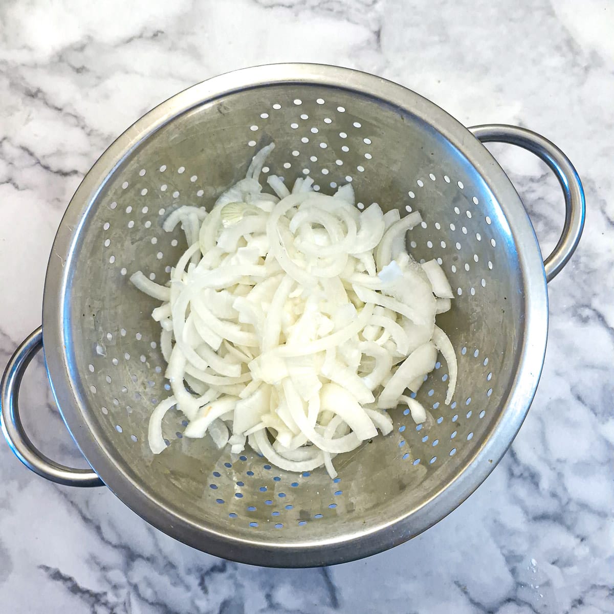 Step 1, sliced onions in a colander.