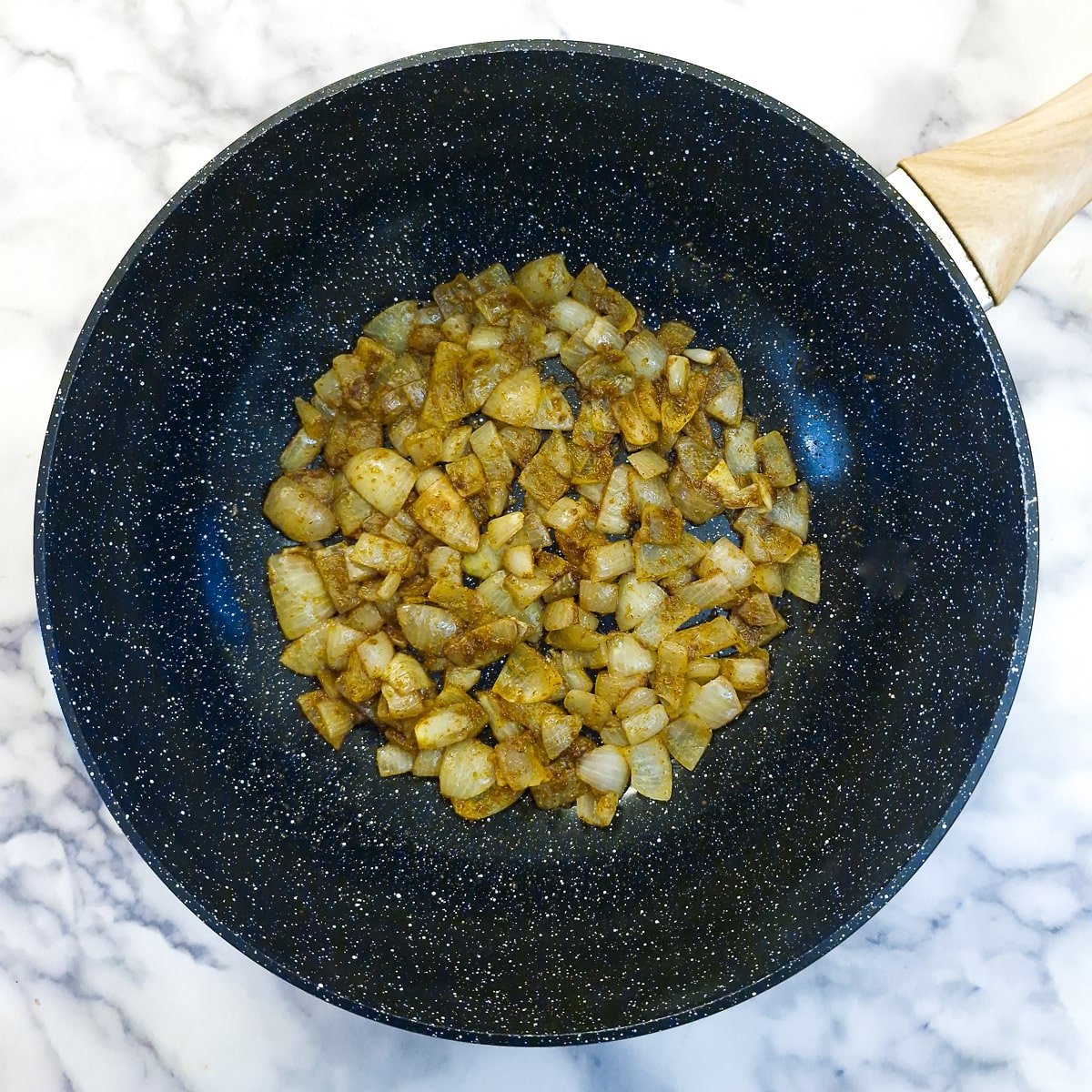 Step 2, curry powder mixed with the onions.