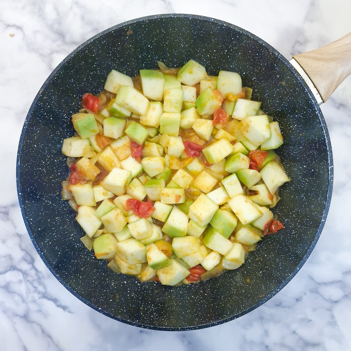 Step 4, diced marrow added into the wok.