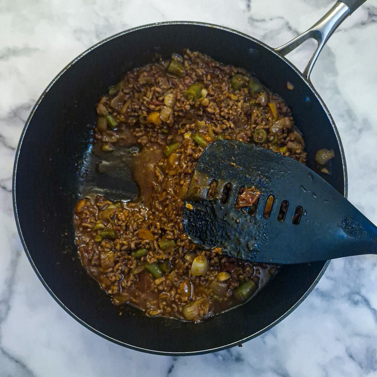 A pan of fully cooked lamb keema ready to be stuffed into a marow.