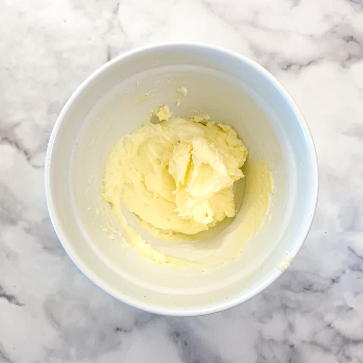 Creamed butter and sugar in a mixing bowl.