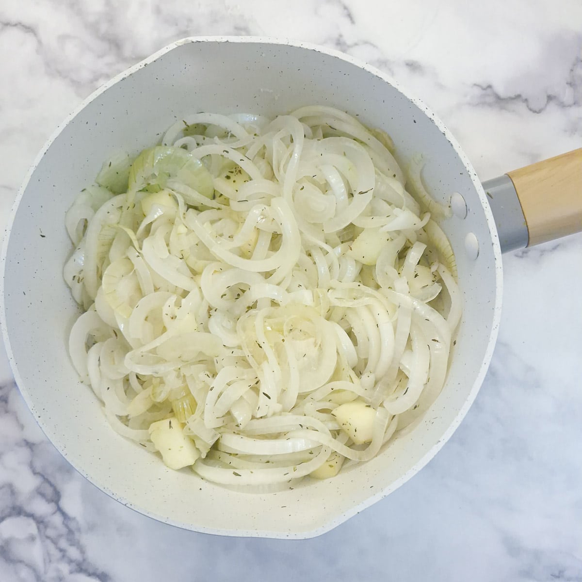 Step 3, apples and onions which have been cooked for 15 minutes in a covered saucepan.