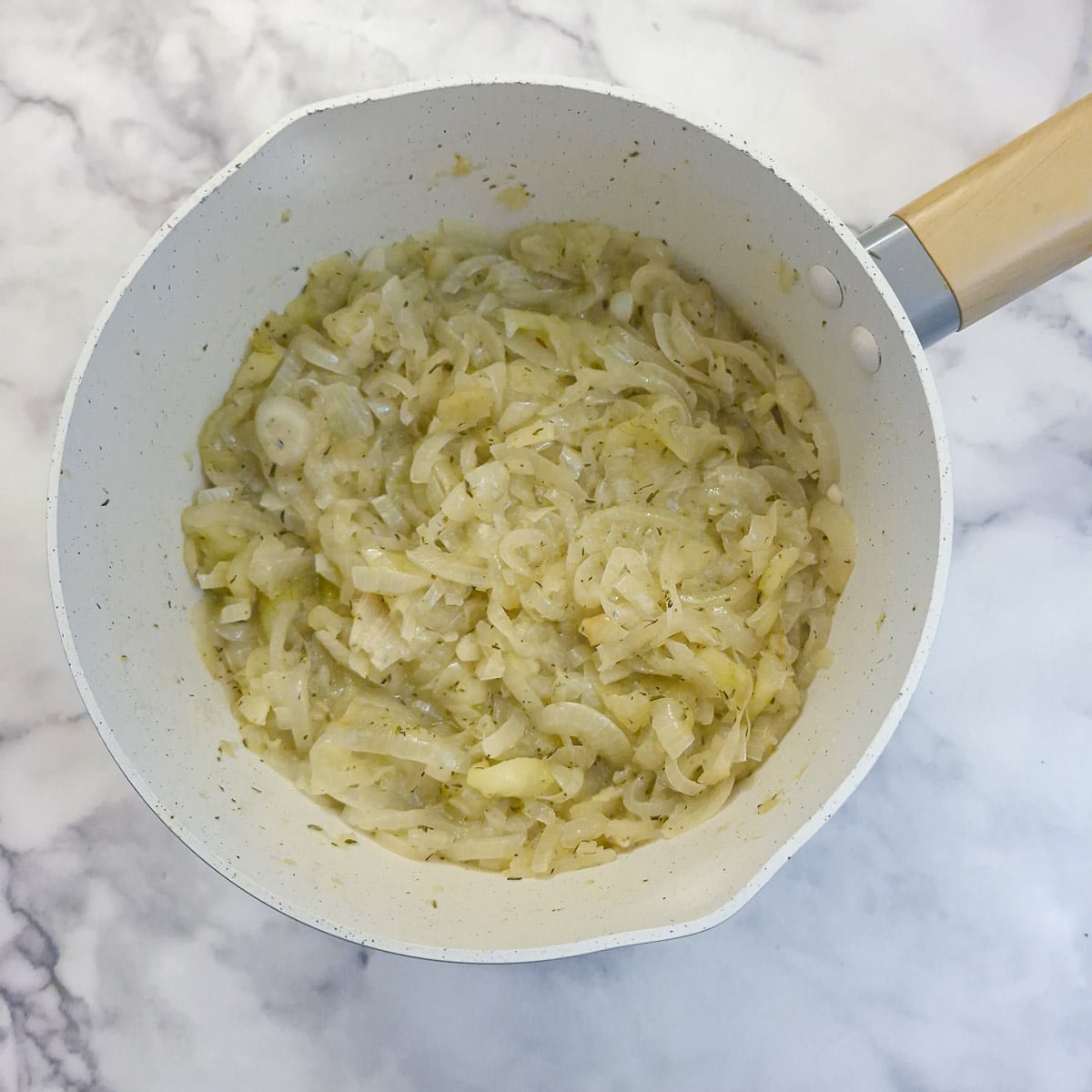 Step 4, the apples and onions are cooked for 30 minutes. The apples have completely broken down and the onions have softened.