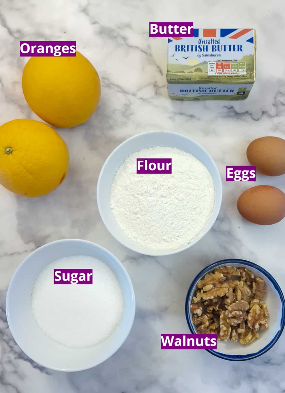 Ingredients for making an orange walnut drizzle cake.