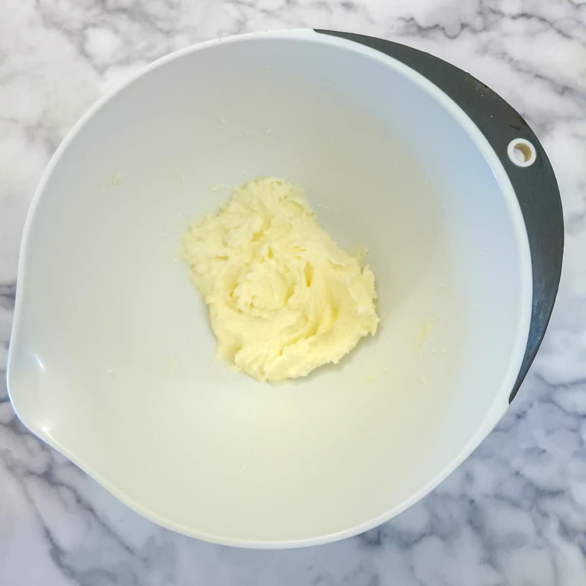 Step 1, butter and sugar creamed together in a mixing bowl.