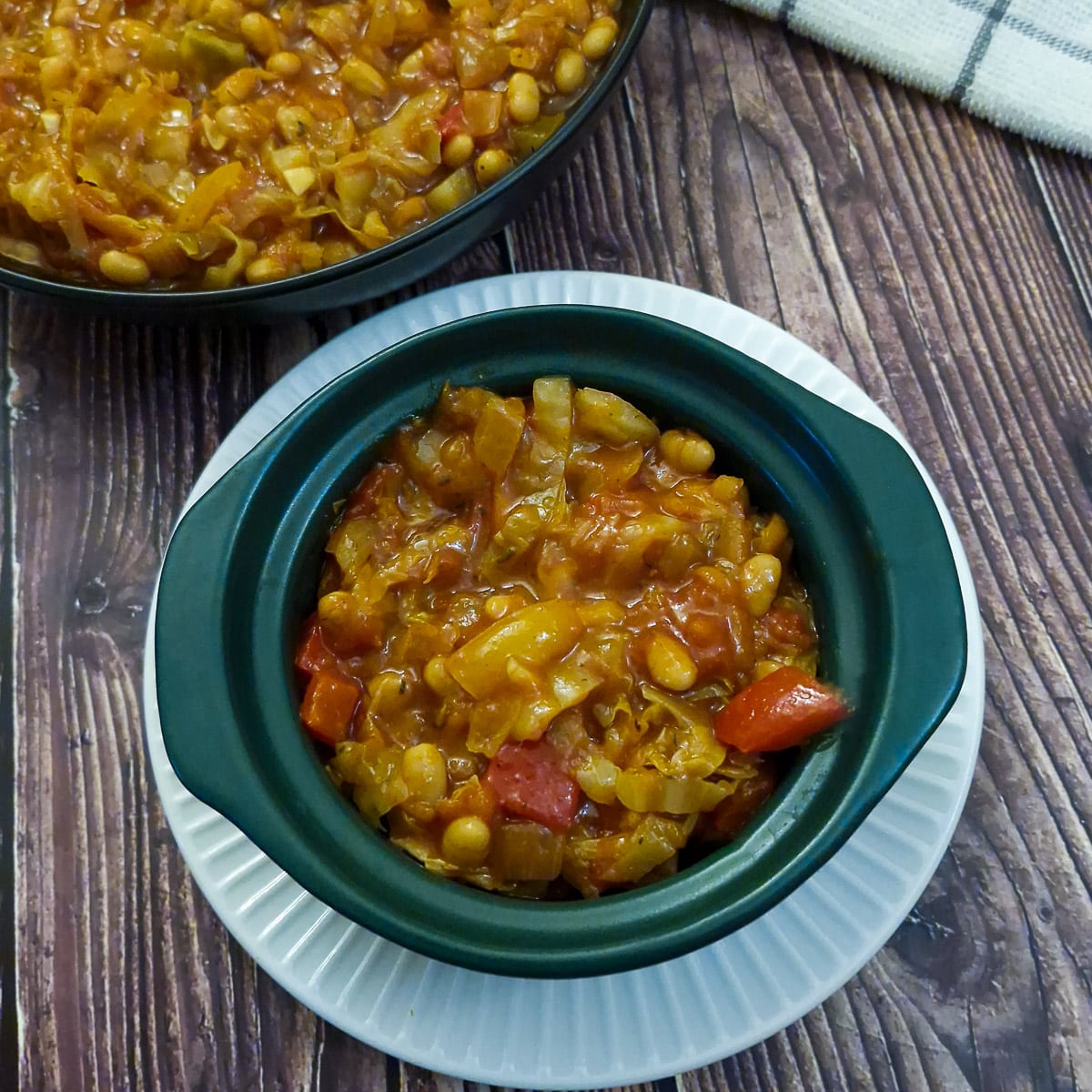 A serving of chakalaka in a small casserole dish.
