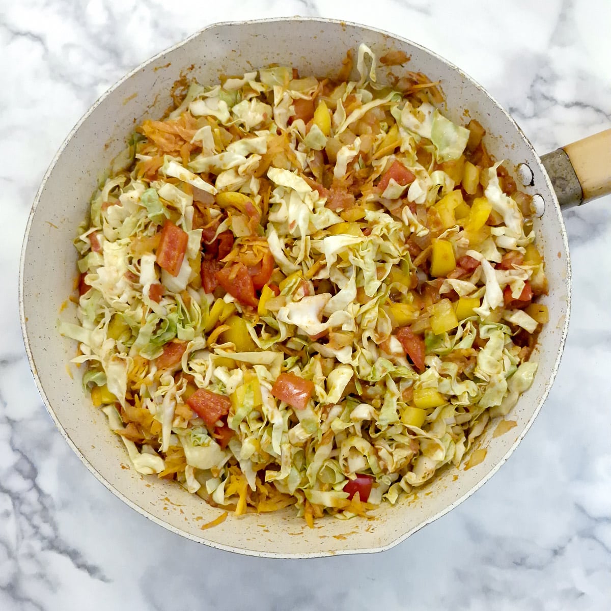 Step 5, the vegetables combined with the tomato mixture in a pan.