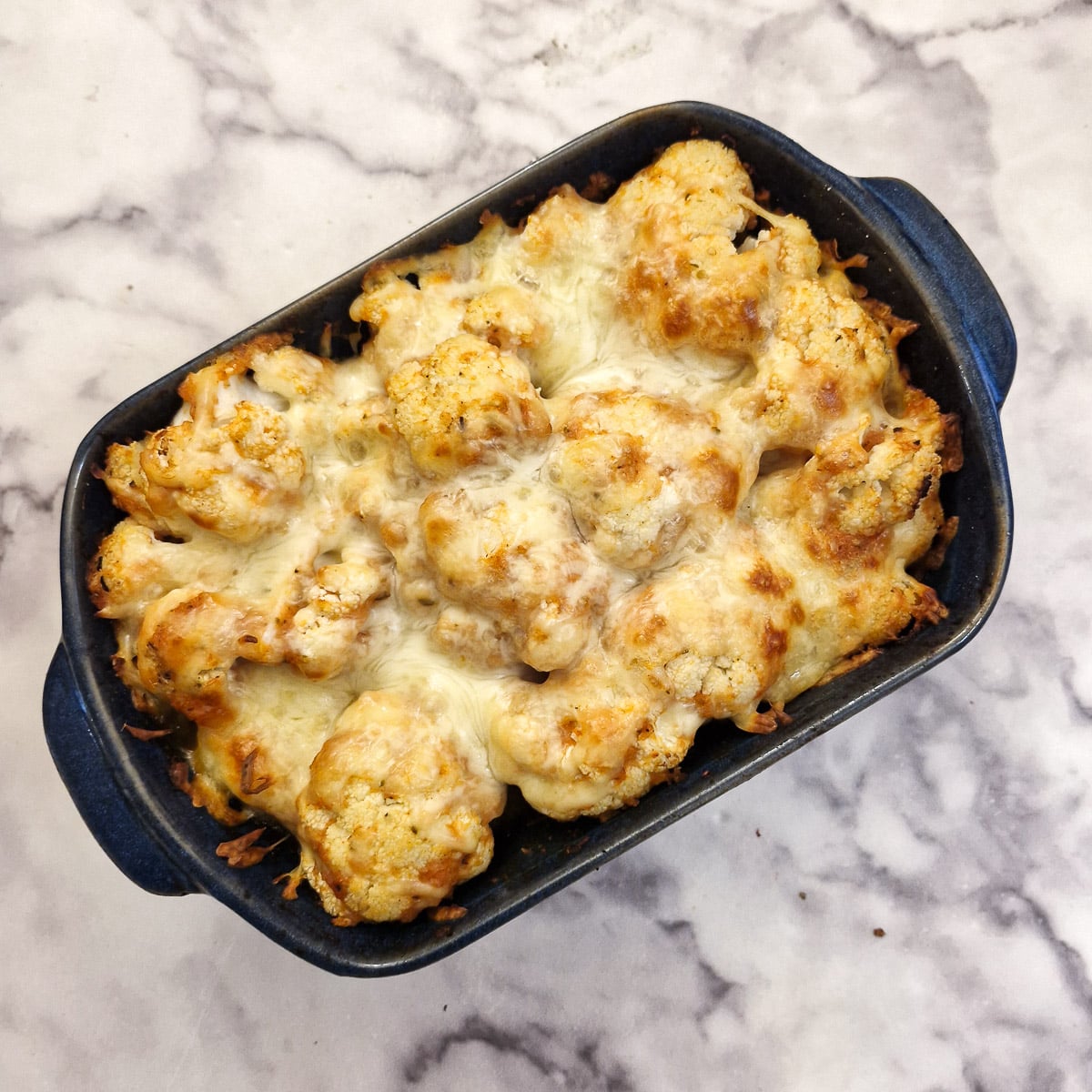 Step 5, a fullly cooked cheesy cauliflower tomato bake.