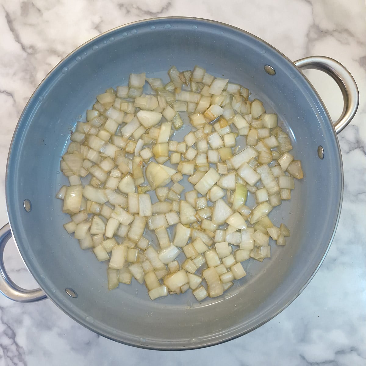 Step 3 - diced onions softening in the lamb fat.