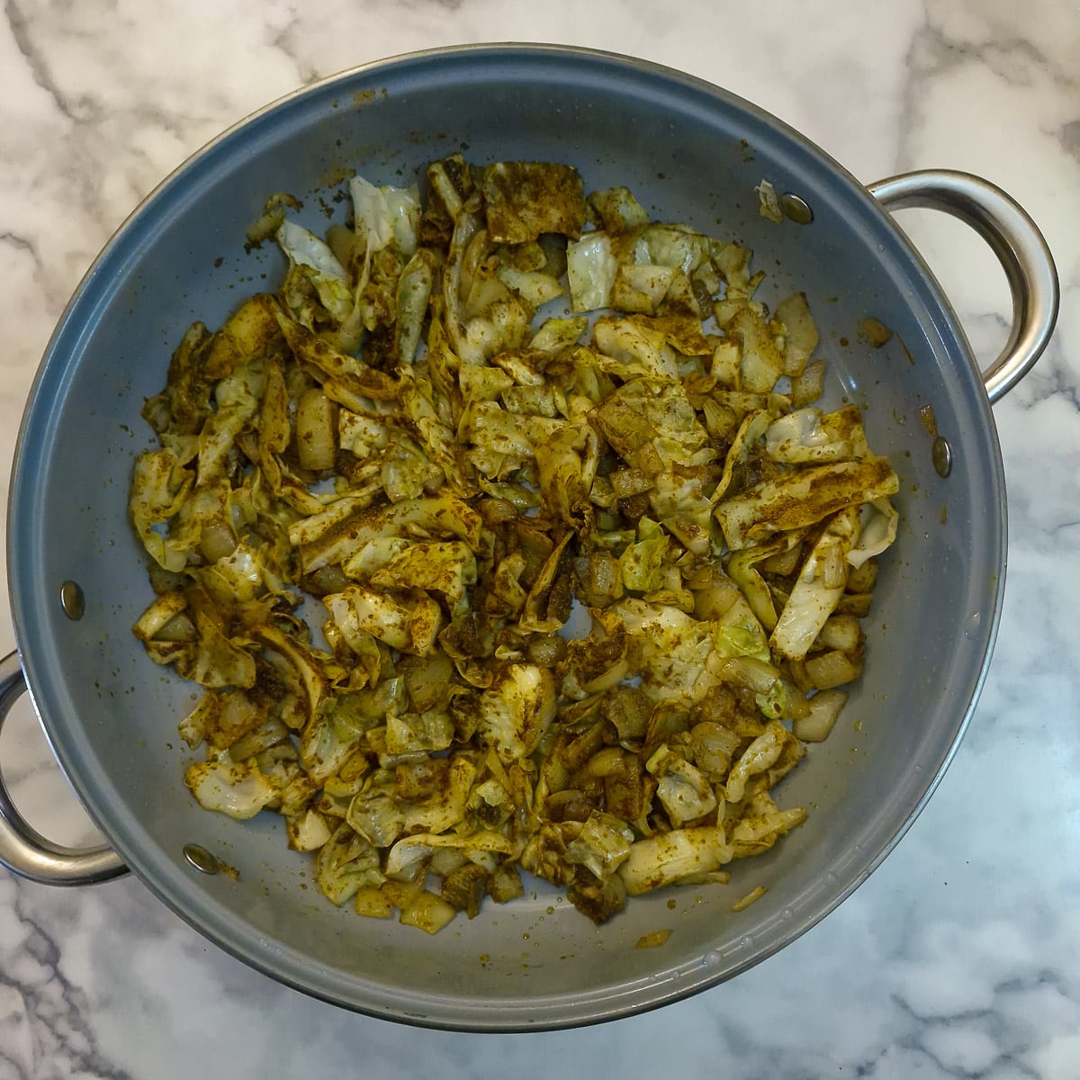 Step 5 - curry powder mixed into the cabbage and onions.