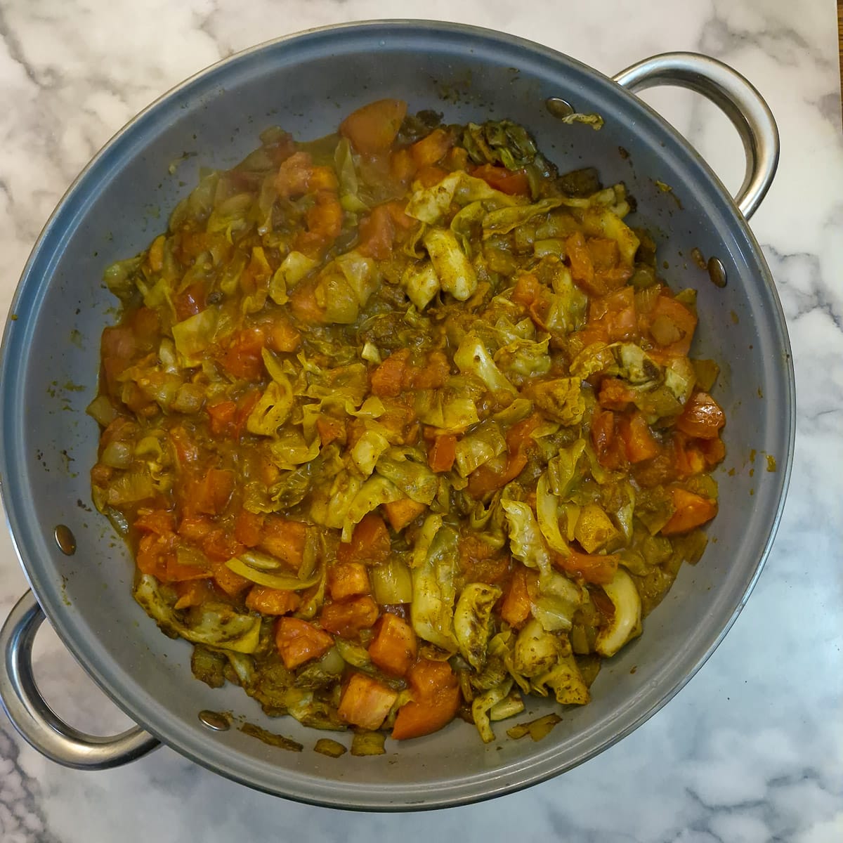 Step 6, tomatoes softening with the cabbage and onion mixture.