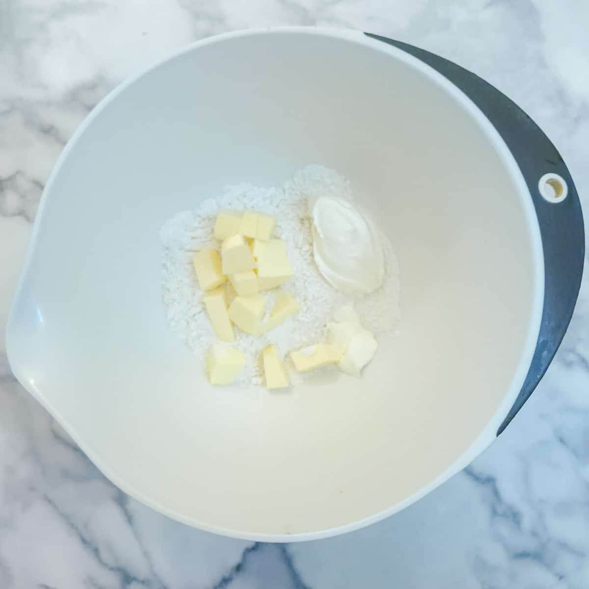 Step 1, flour, butter and cream cheese in a mixing bowl.