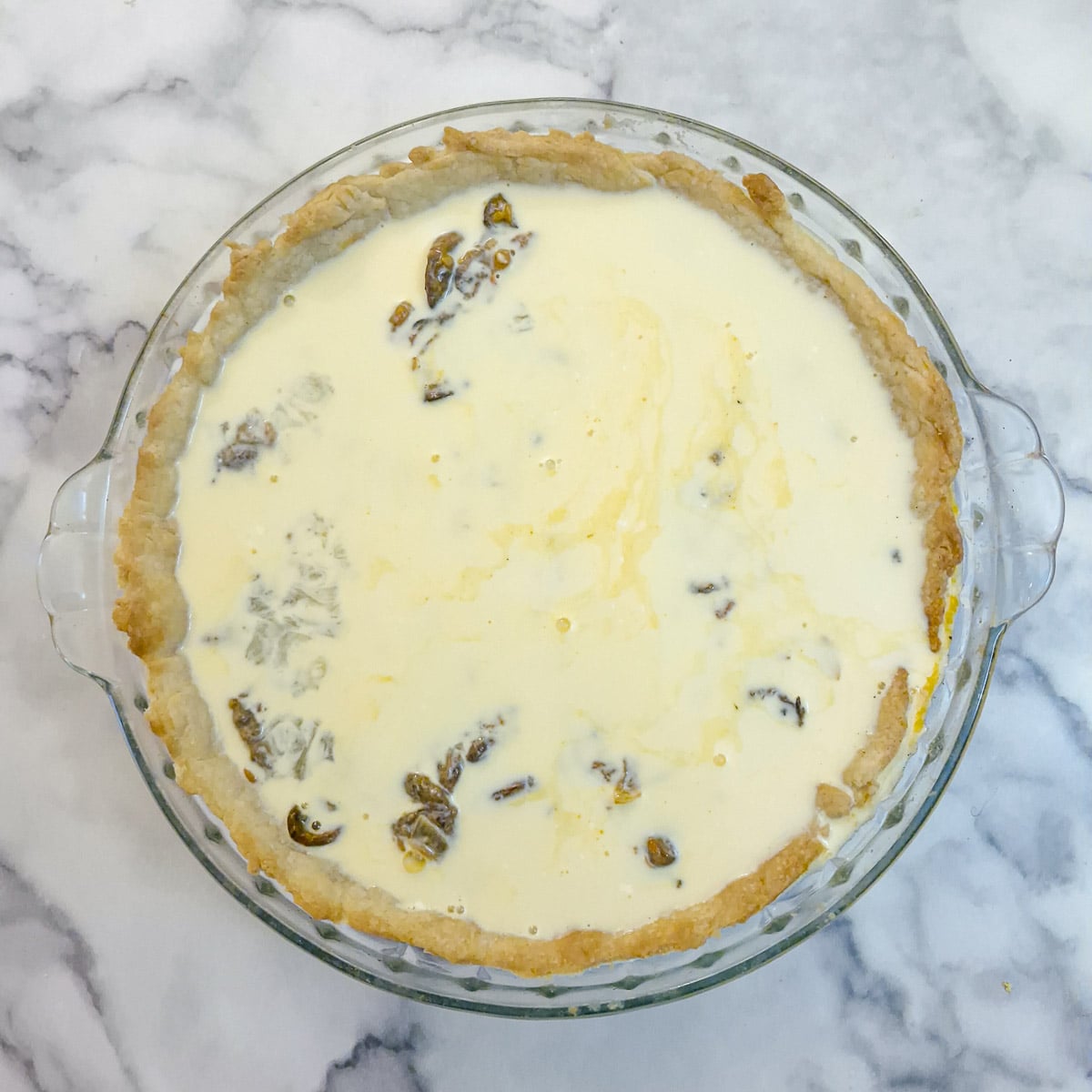 Step 11, egg and cream mixture poured into the quiche shell.