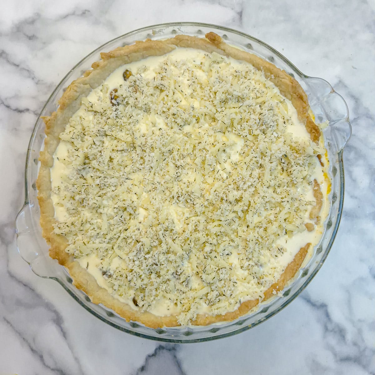 Step 13, breadcrumbs and cheese sprinkles over the top of the quiche.