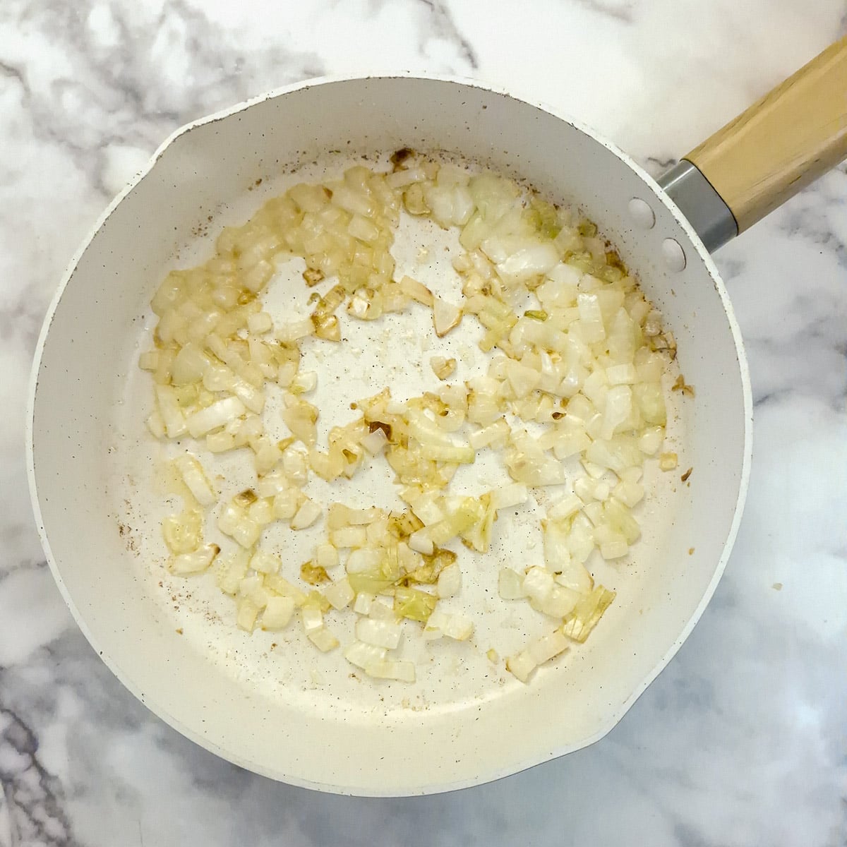 Step 1, onions browning in a frying pan.