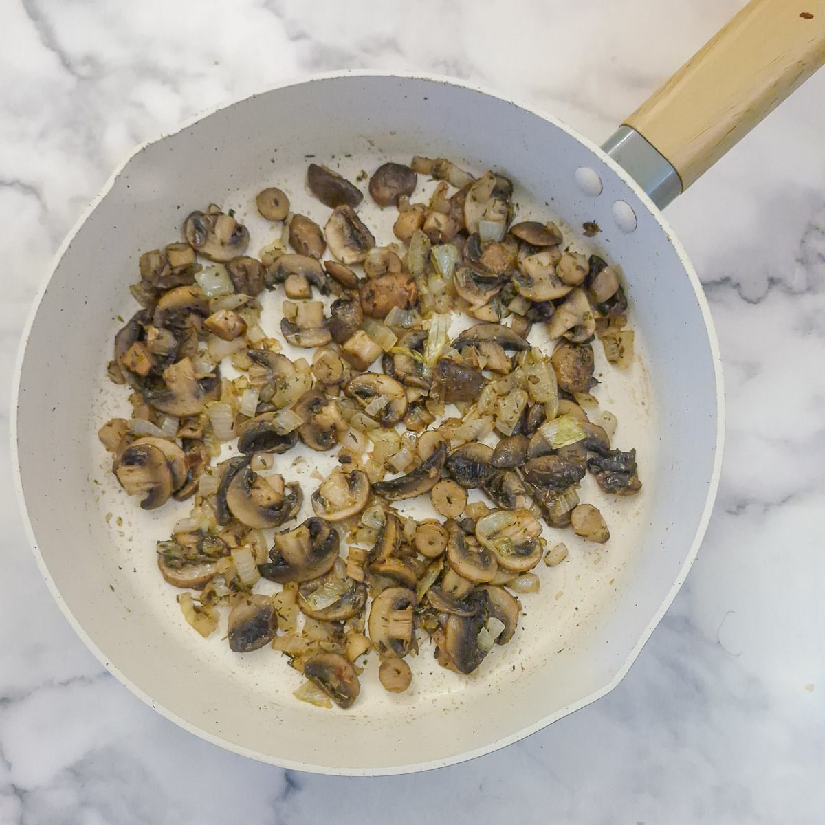 Step2, mushrooms added to the onions and allowed to soften.