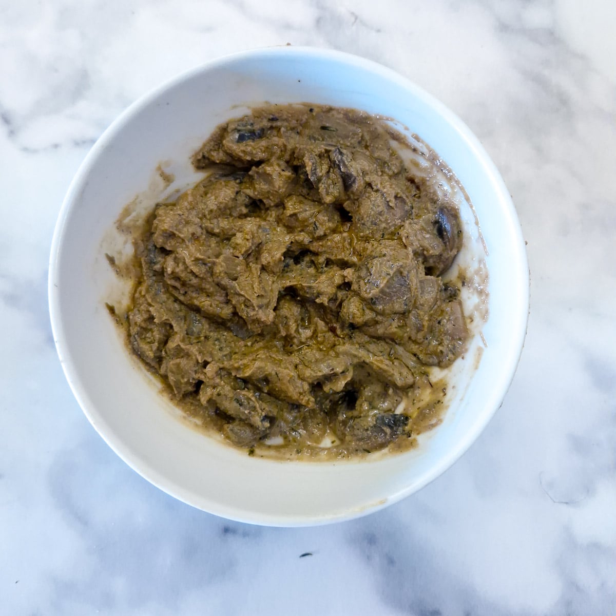 Step 4, half of the mushroom mixture combined with pate to form the chicken stuffing.