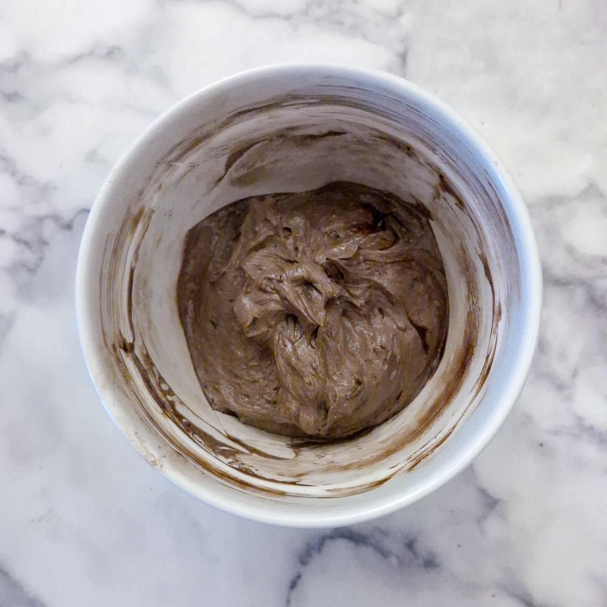 Step 10, Cocoa powder mixed into the icing sugar to form a chocolated-coloured buttercream.